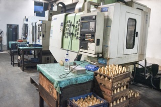 Asha Industries skilled team operating LMW CNC machines for high-precision parts